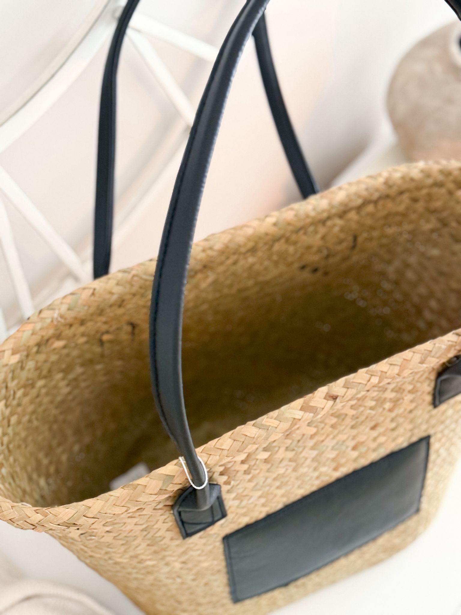Seagrass basket bag with matt black panel and handles