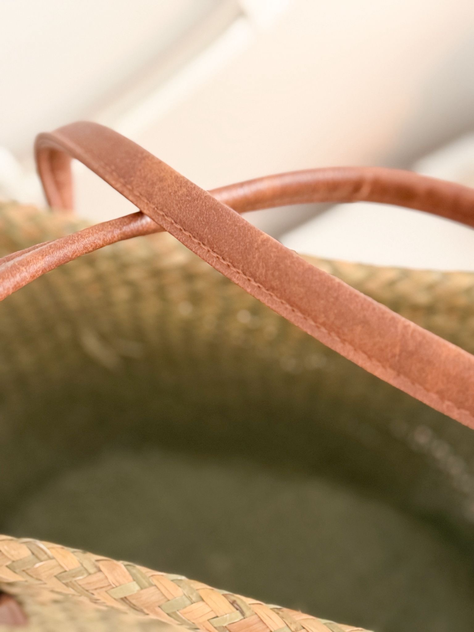 Seagrass basket bag with tan panel and handles