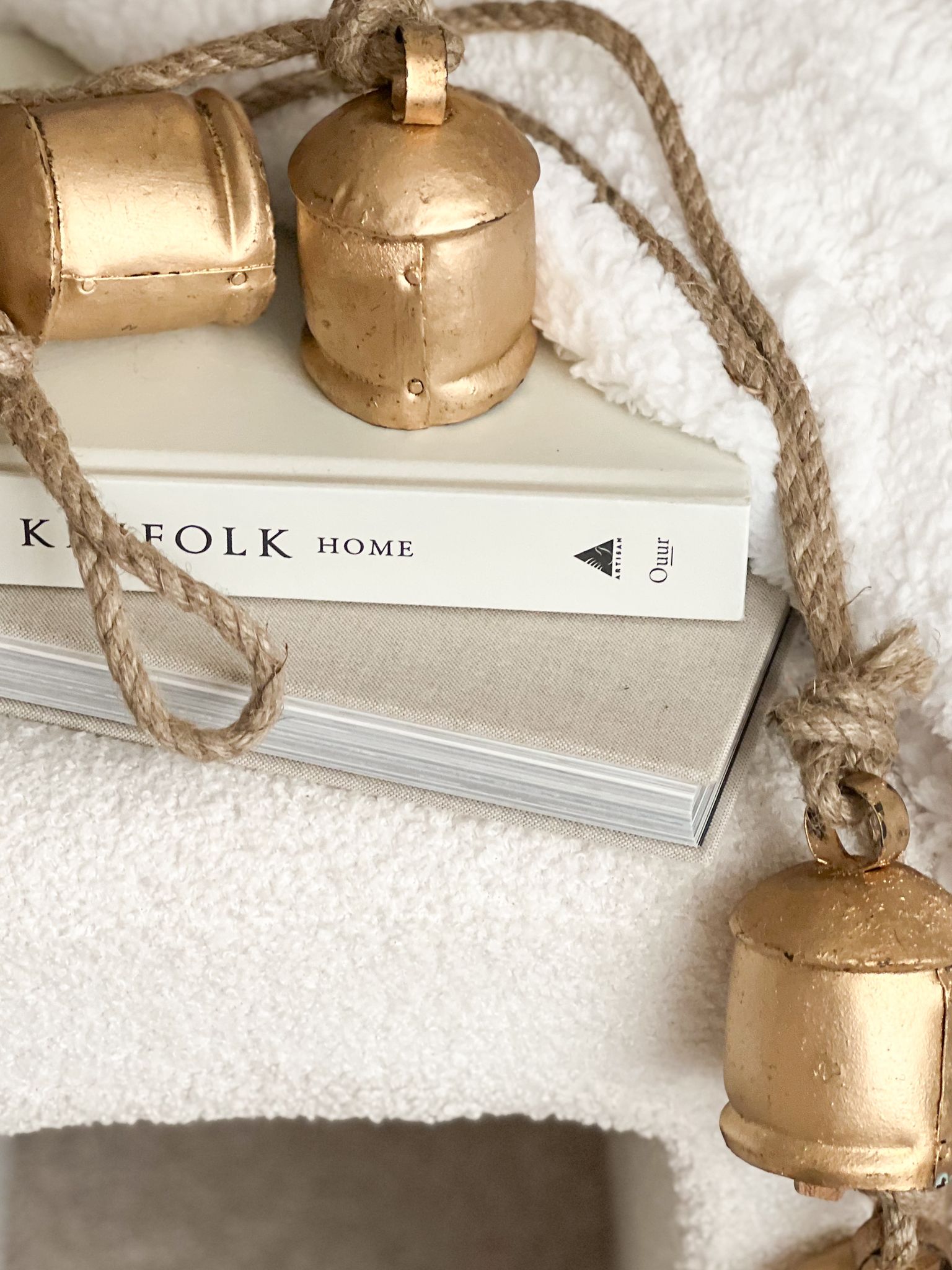 Four vintage style bells on hanging rope
