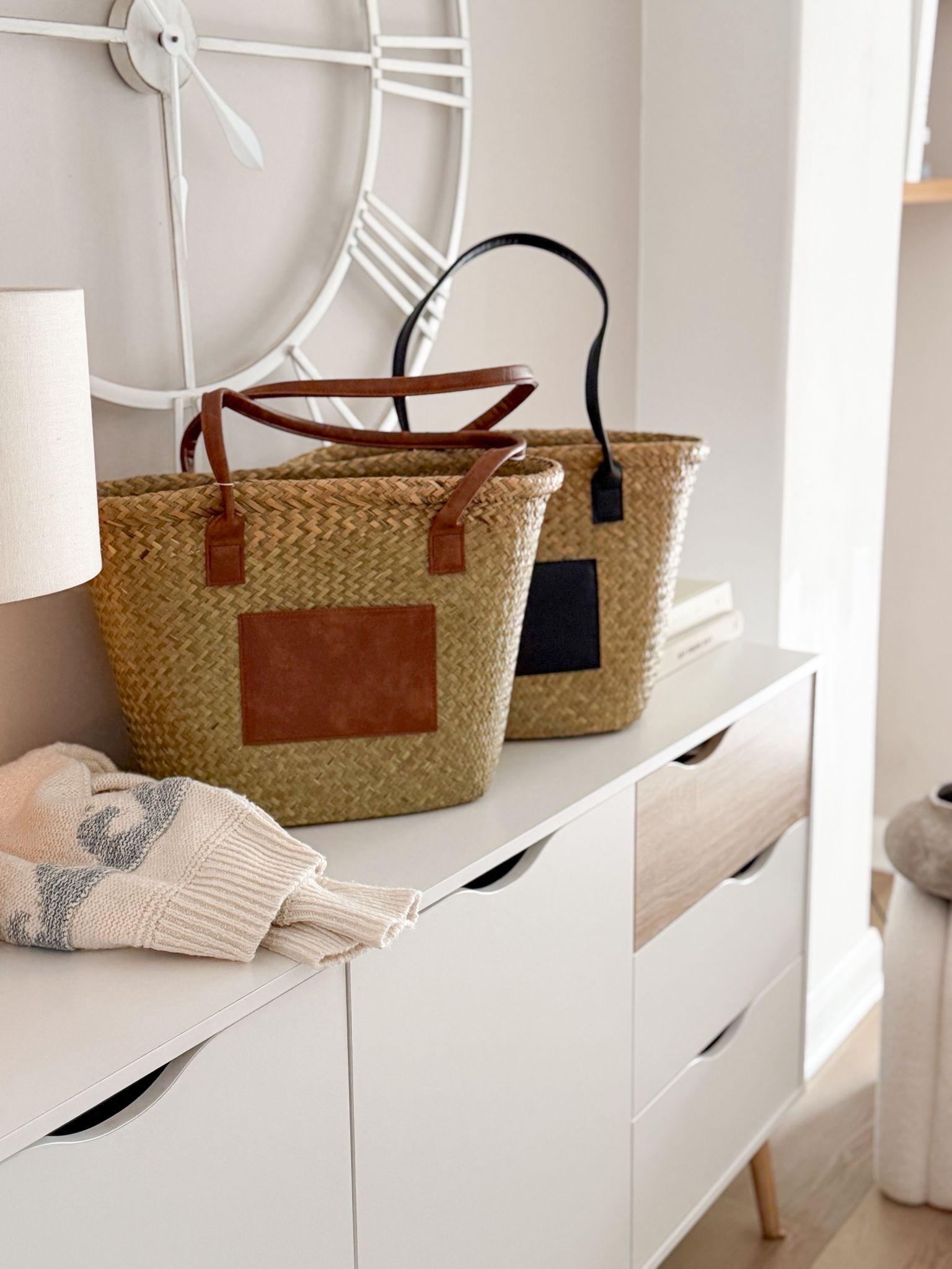 Seagrass basket bag with tan panel and handles