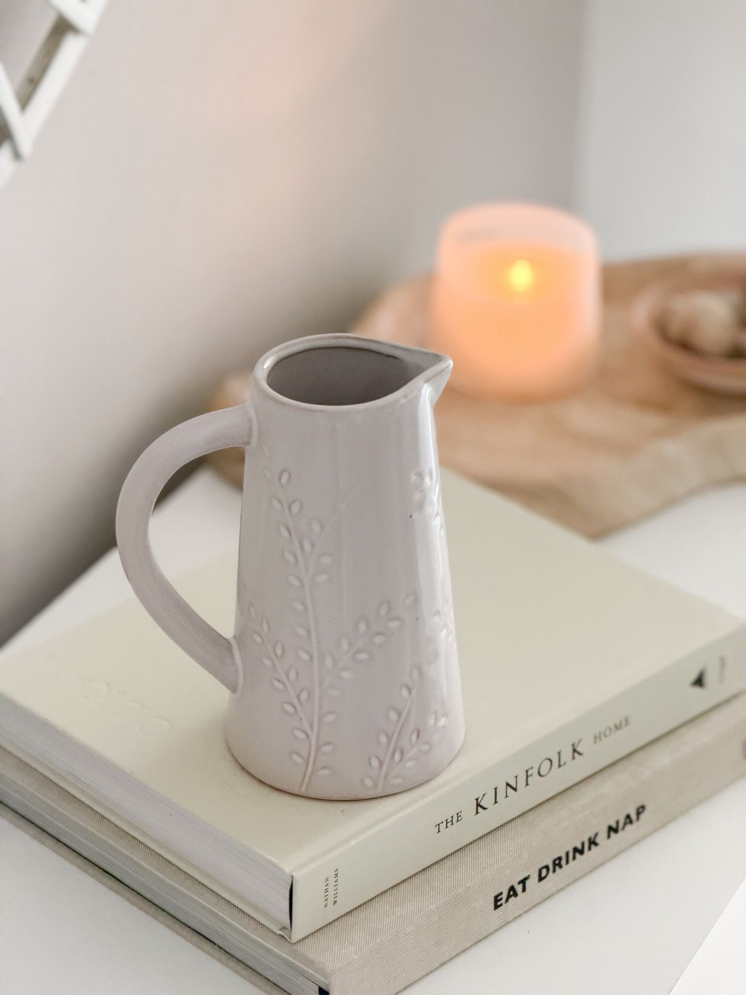 Ceramic natural jug with pretty leaf decoration