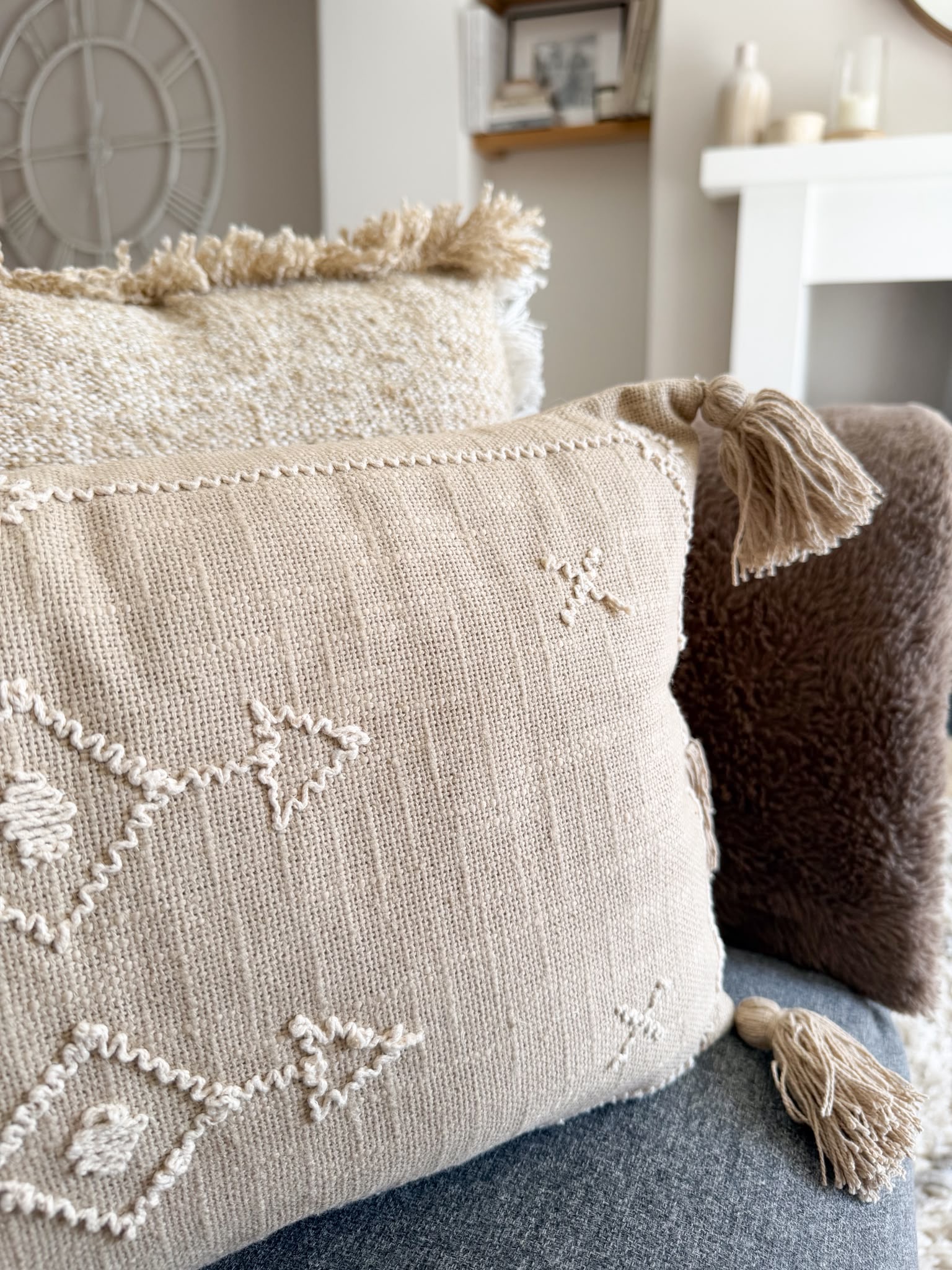 Decorative stitch stone cushion with tassels