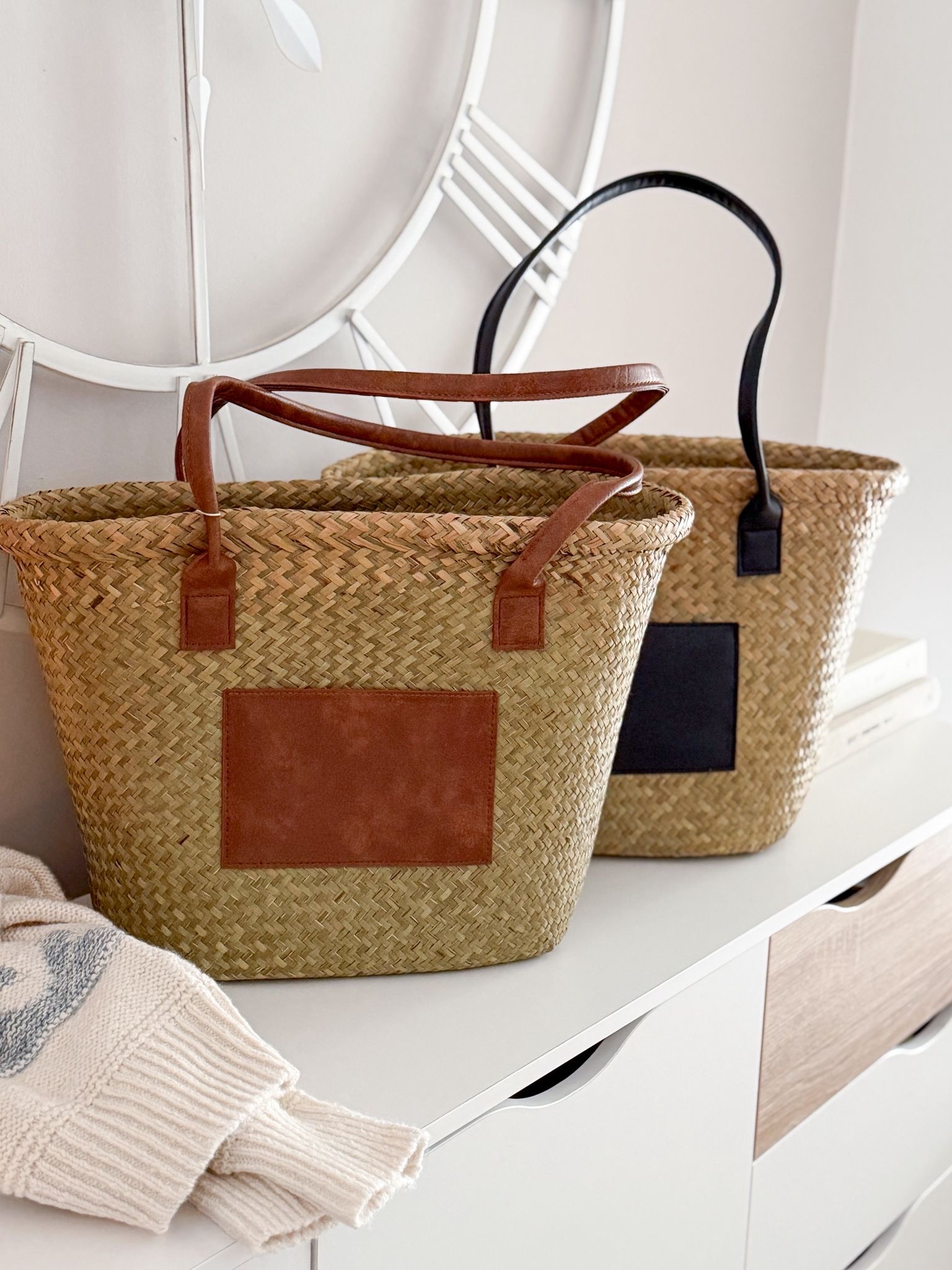 Seagrass basket bag with matt black panel and handles