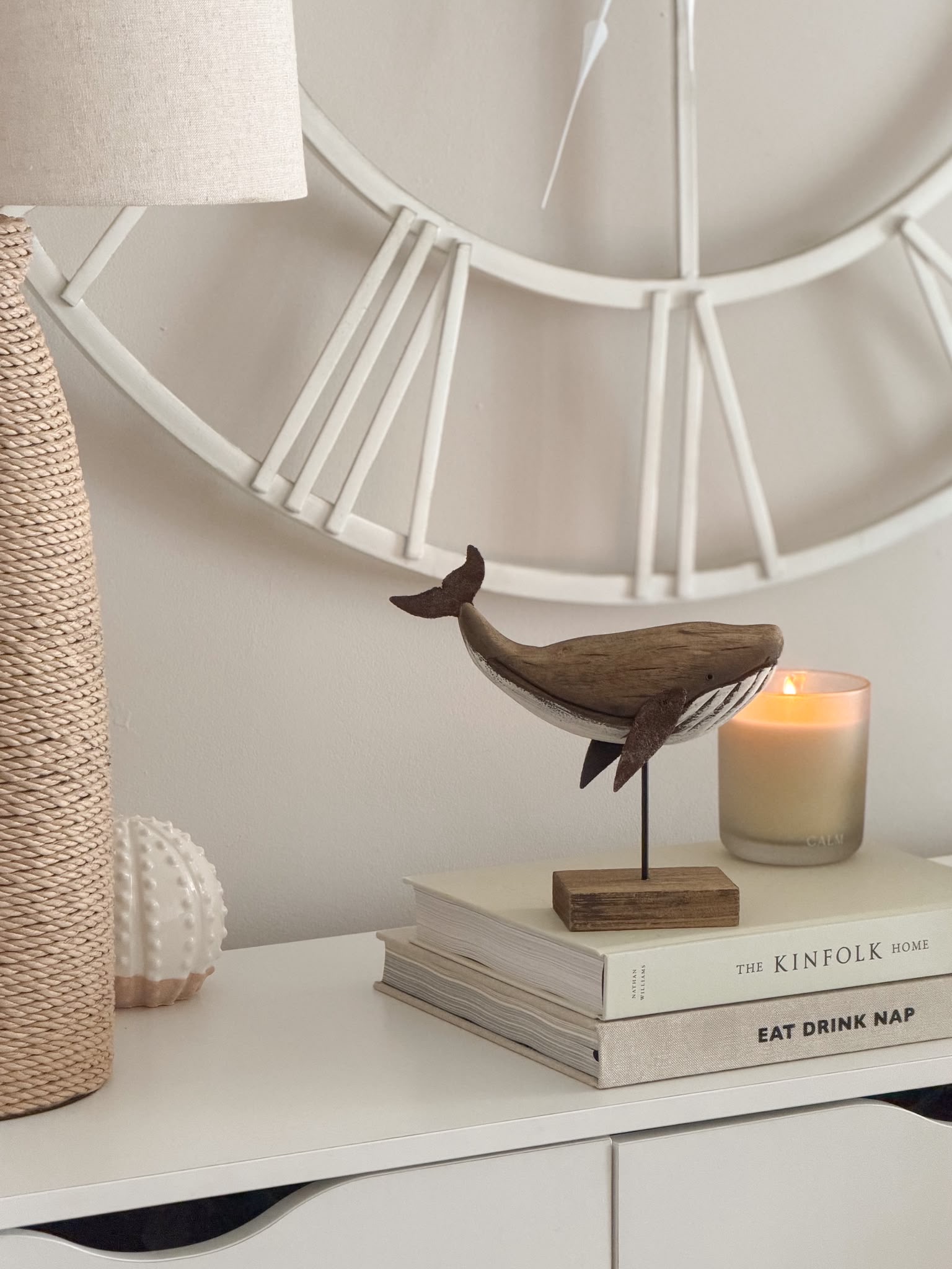 Decorative wooden whale on stand