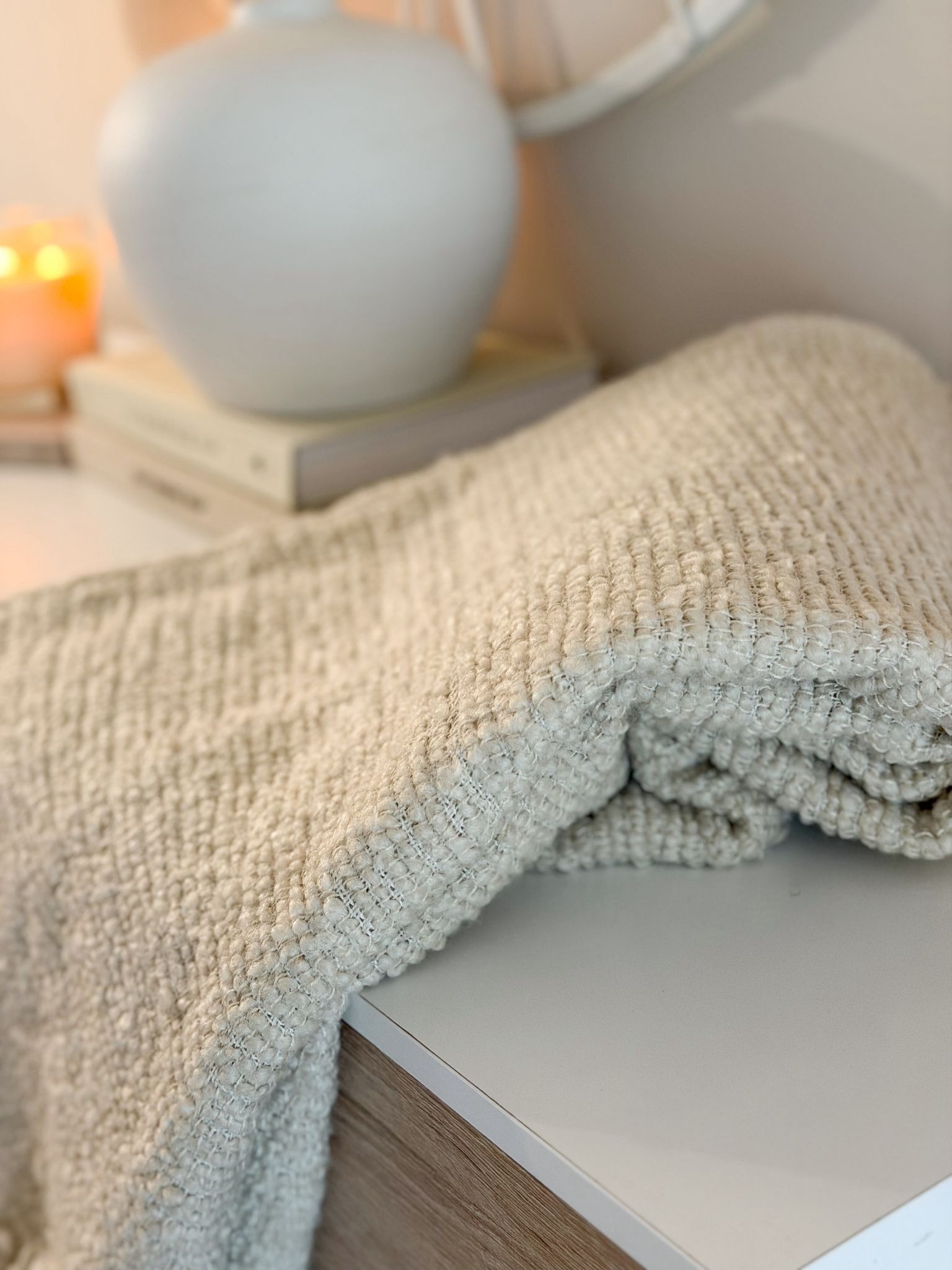 Textured tassel boucle throw in ecru