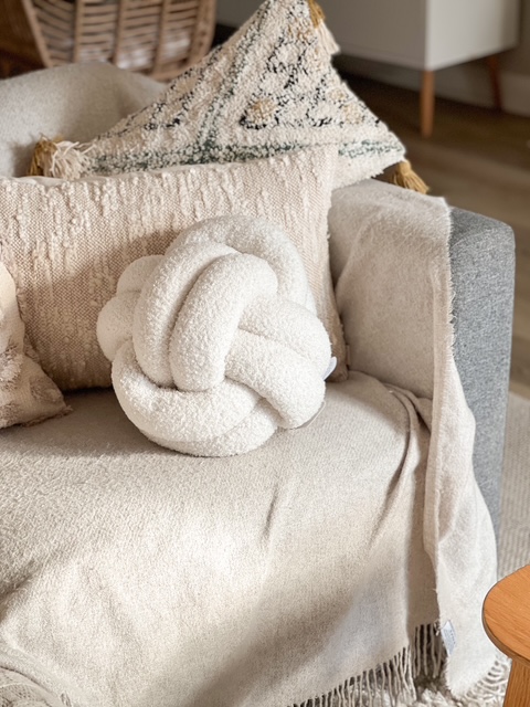 Large cream Nordic boucle knot cushion