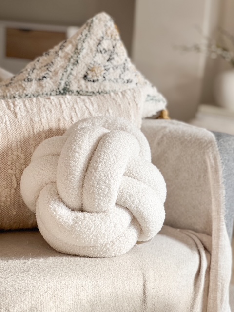Large cream Nordic boucle knot cushion