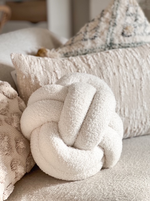 Large cream Nordic boucle knot cushion