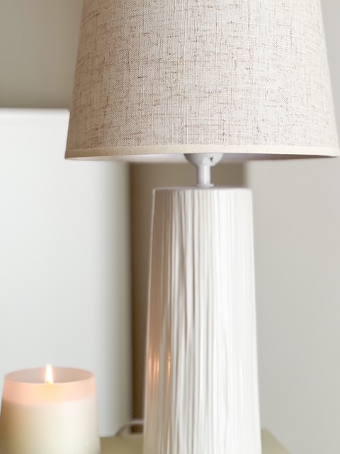 Textured base ceramic lamp with beige linen shade