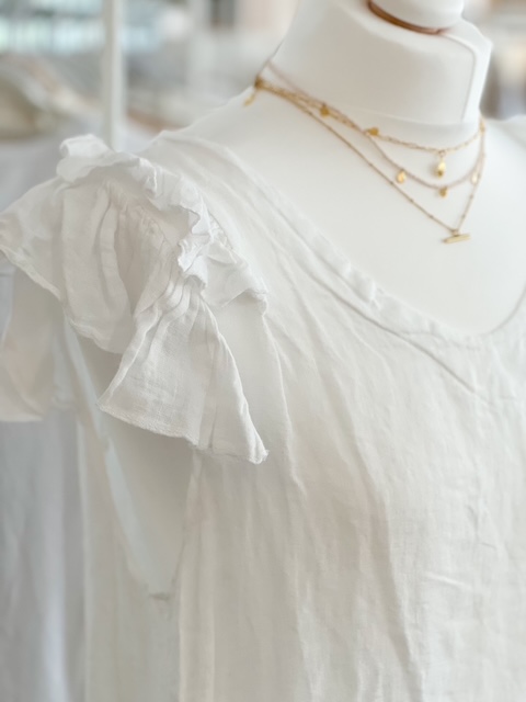 White linen ruffle shoulder tunic dress