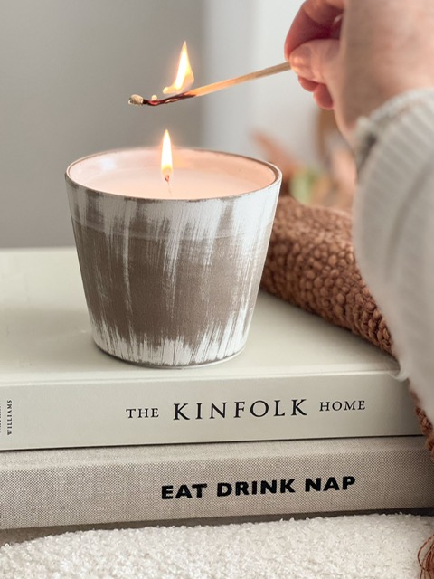 Ceramic lightly distressed pot with candle