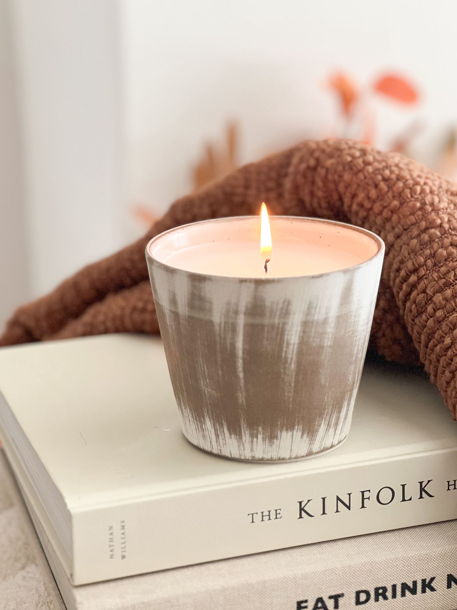 Ceramic lightly distressed pot with candle