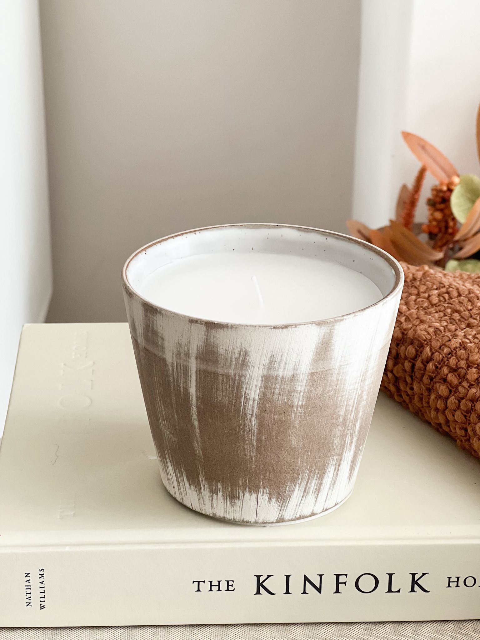 Ceramic lightly distressed pot with candle