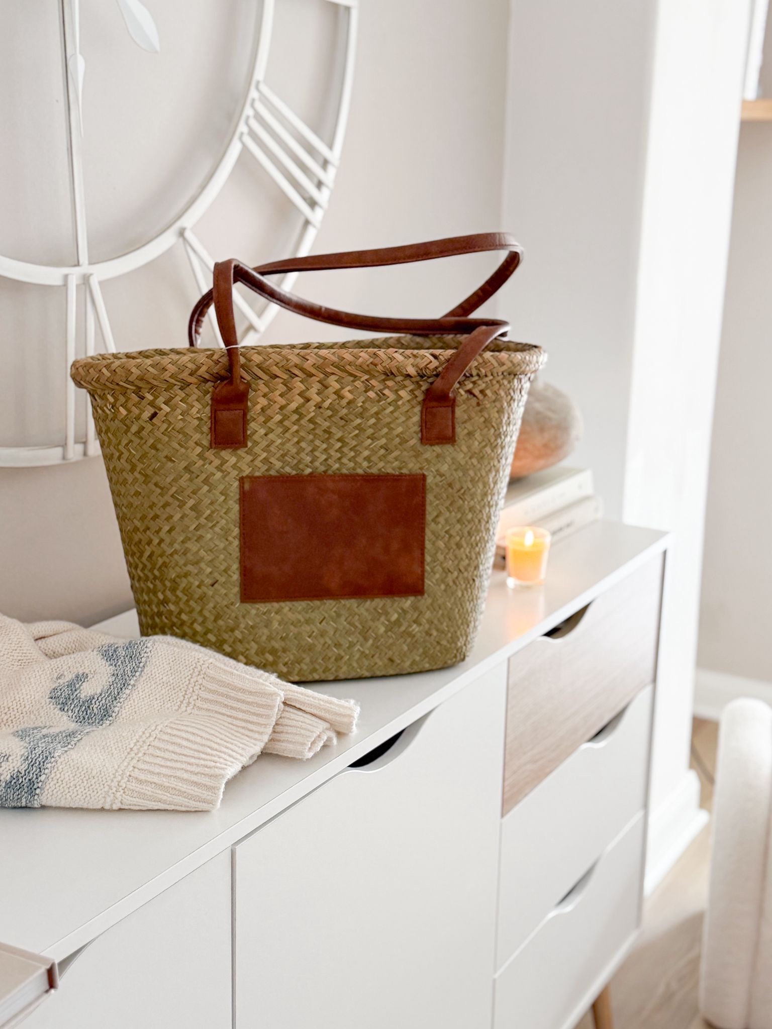 Seagrass basket bag with tan panel and handles