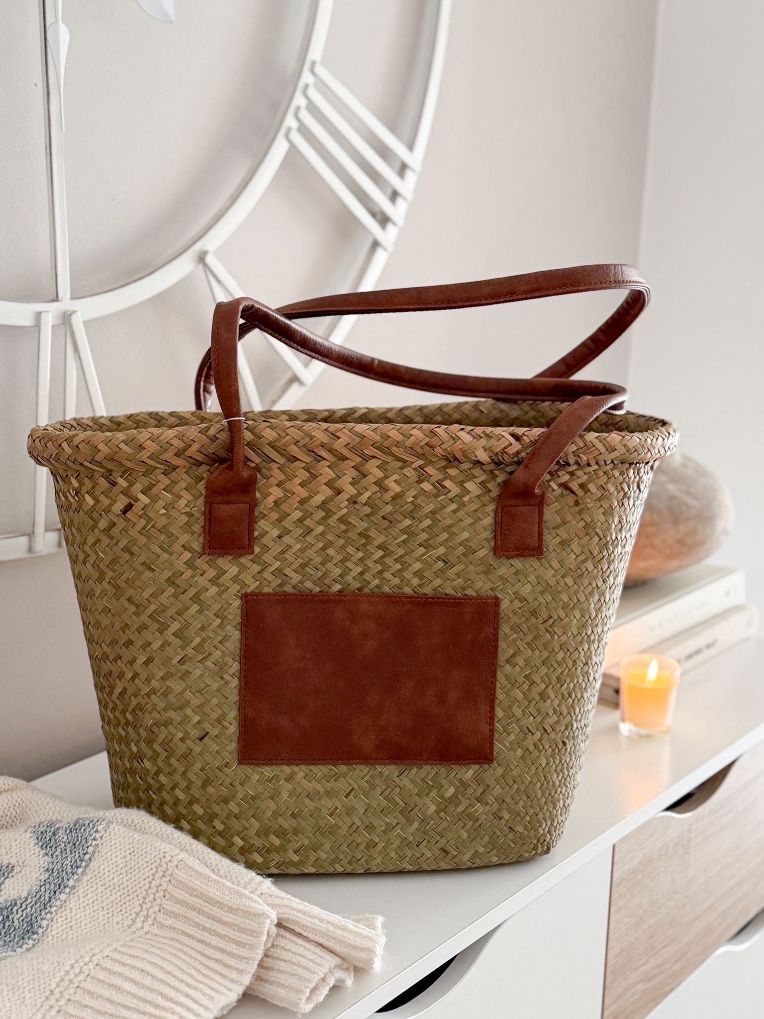 Seagrass basket bag with tan panel and handles
