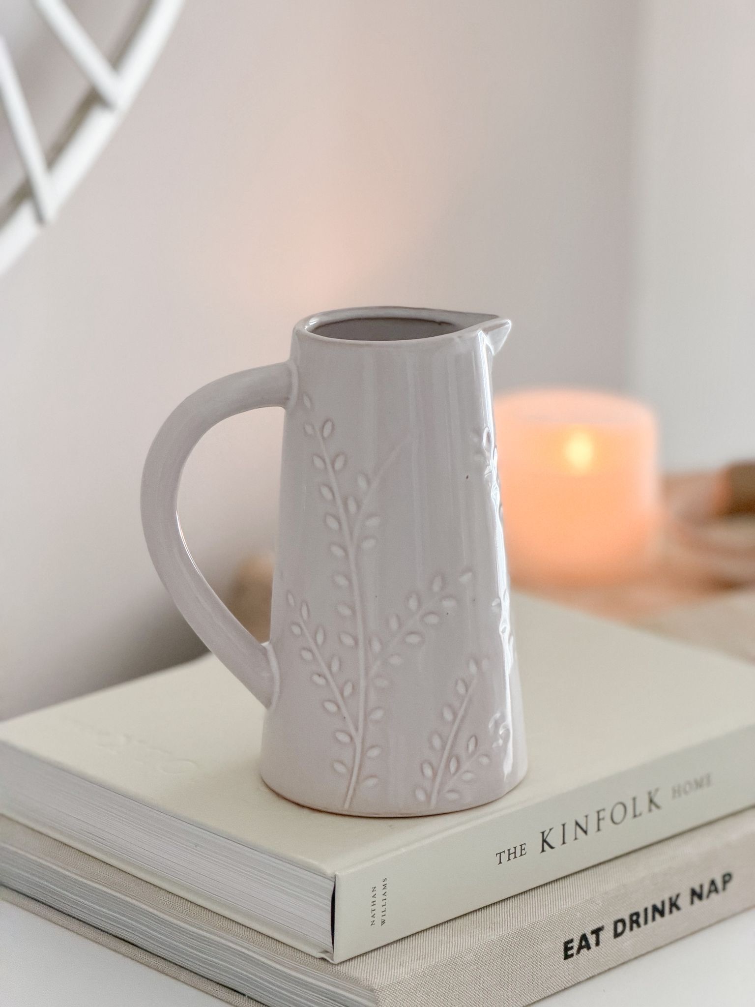 Ceramic natural jug with pretty leaf decoration