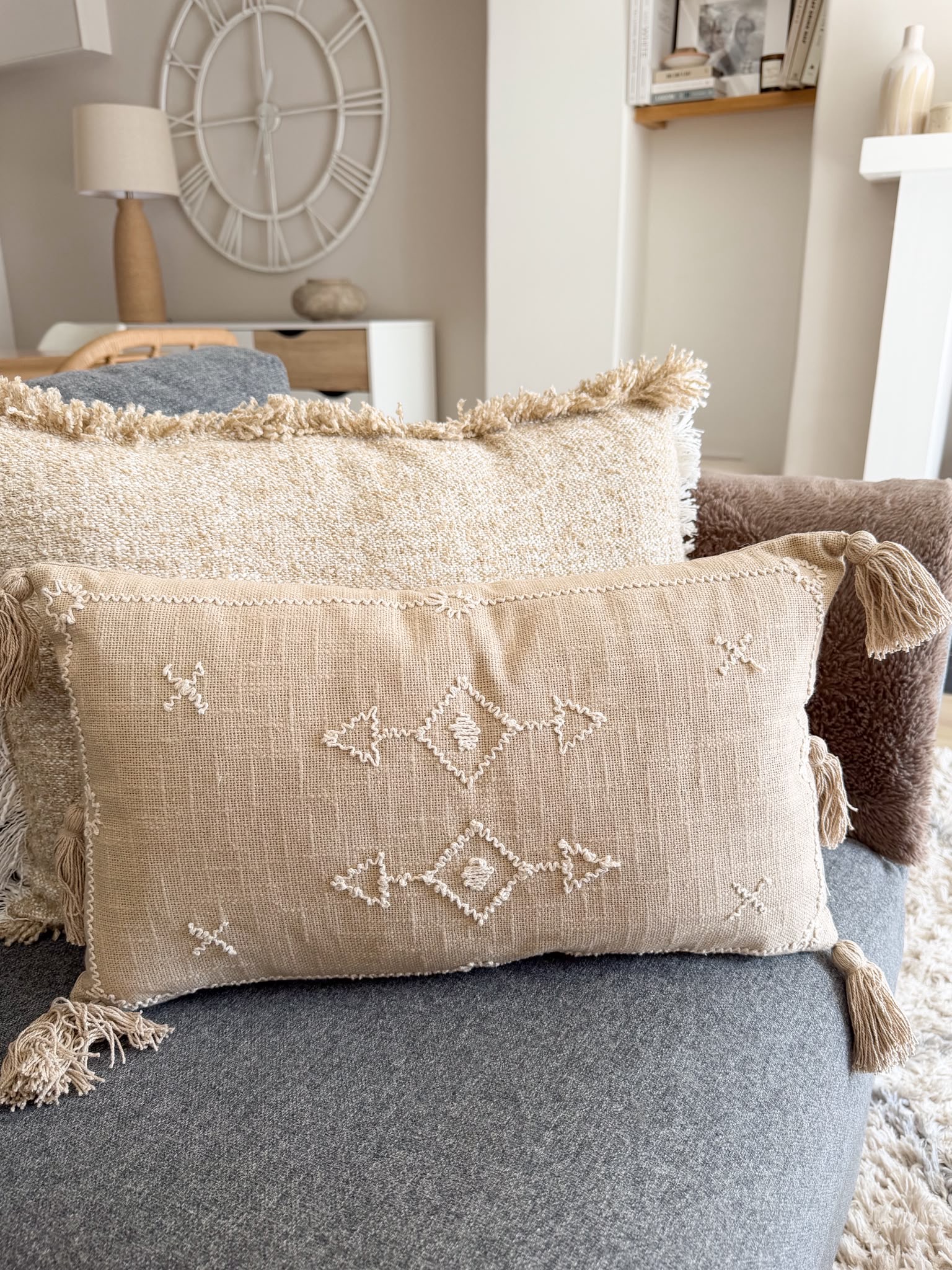Decorative stitch stone cushion with tassels