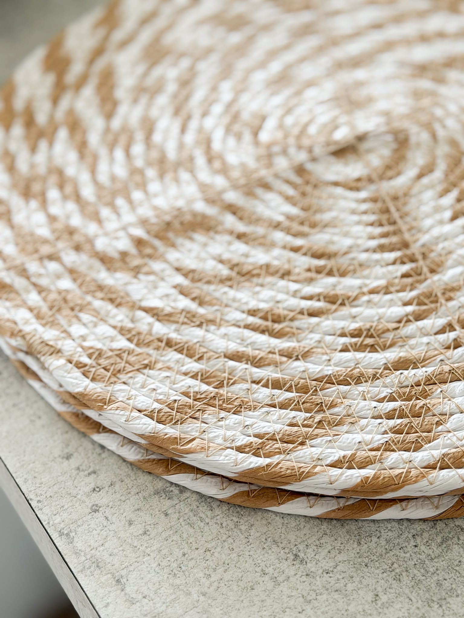 Set of four natural & white woven placemats